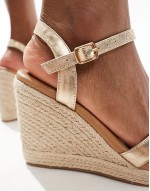 cross strap wedge esapdrilles in gold